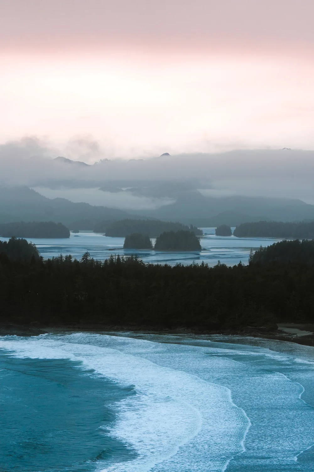 Forested islands and mist across Clayoquot Sound near Tofino