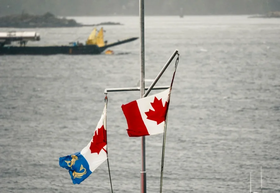 Flags and working boats across Tofino harbour